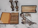 a table with silverware and a box on it