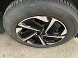the tire of a car with a flat tire on the ground