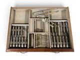 a wooden box filled with silverware and utensils