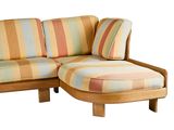 a striped couch with a chaise on it