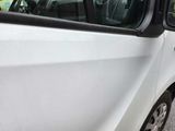 a white van parked on the side of the road