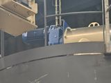 a picture of a machine that is working on a piece of machinery