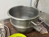 a pot and a bowl of food on a table