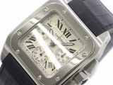 a silver wrist watch with black leather straps on a white surface