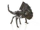 an image of a metal sculpture of a scorpion on a white surface