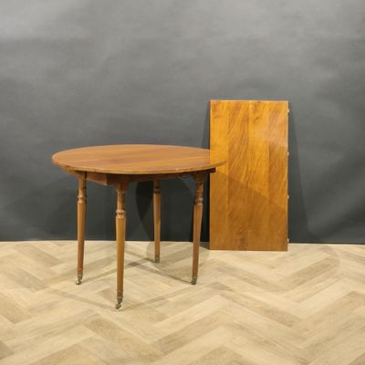an image of a table with a wooden top on a wooden floor