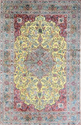 un tapis jaune et bleu orné d'un motif en médaillon
