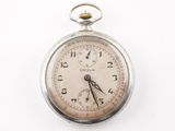 an old pocket watch with a chain hanging from it ' s side