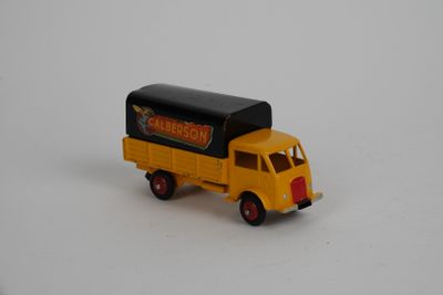 a toy truck that is sitting on a white surface