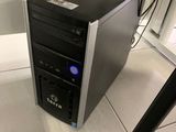 a computer that is sitting on the floor next to a table