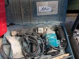a tool box with tools inside of it on the floor
