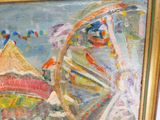 un tableau représentant une grande roue, exposé dans un cadre doré