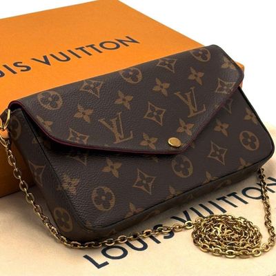 an image of a louis vuitton purse with a chain