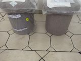 two trash cans that are sitting on the floor