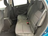 the back seats of a blue car are clean and ready to be used
