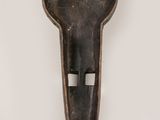 a close up of a metal object on a white surface