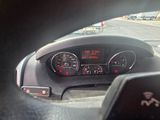 dashboard of a car with a view of a parking lot through the window