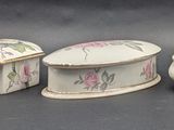 five pieces of pottery sitting next to each other on a table