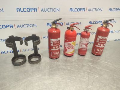 a group of fire extinguisors sitting on top of a table
