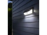 a close up of a light on the side of a building
