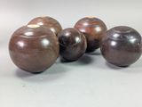 three brown vases sitting on top of a table next to each other