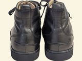 black leather shoes with laces and zippers on the sole