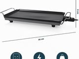 an image of a large black grill on a white background