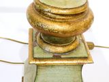 a green lamp that is on top of a table