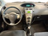 a dashboard of a car with a digital clock on it