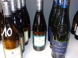 bottles of wine are lined up on a counter top