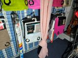 a small room with a lot of items hanging on the wall