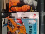 many books in a plastic box on the shelf