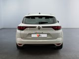 the rear end of a white car in a white room