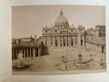 an old picture of a large building with a fountain in front of it