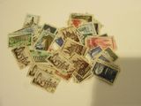 a lot of stamps that are on the table