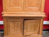 an image of a wooden cabinet in a room