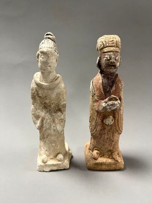pair of chinese figurines of a man and a woman