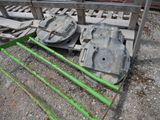 a pile of old metal parts sitting on a pallet