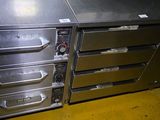 a metal cabinet with four drawers on it in a room
