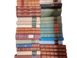 a lot of books stacked on top of each other