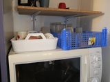 a microwave sitting on top of a microwave oven
