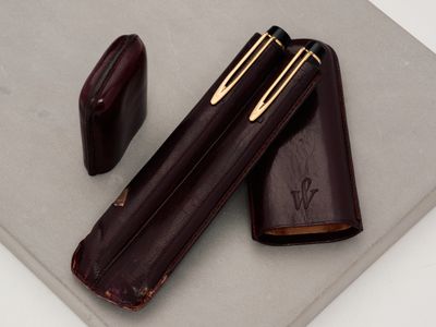 a pen and a pencil case on a table