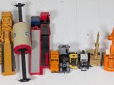 a lot of toy vehicles that are lined up on a table