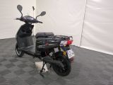 a scooter that is parked in a room