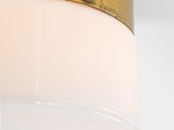 close up of a light fixture with a glass shade on the ceiling