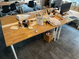 a desk with a lot of clutter on it