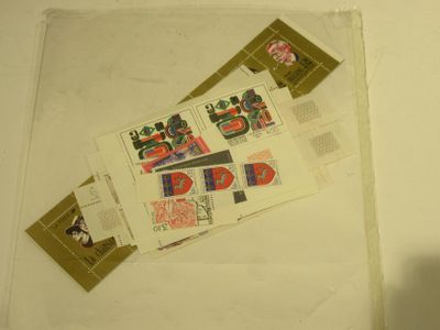 a lot of stamps on the counter top of the bathroom