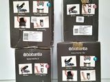 three boxes of shoes are stacked on top of each other on a table
