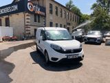 a white van that is parked in front of a building