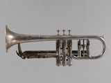 a silver trumpet that is hanging from the ceiling